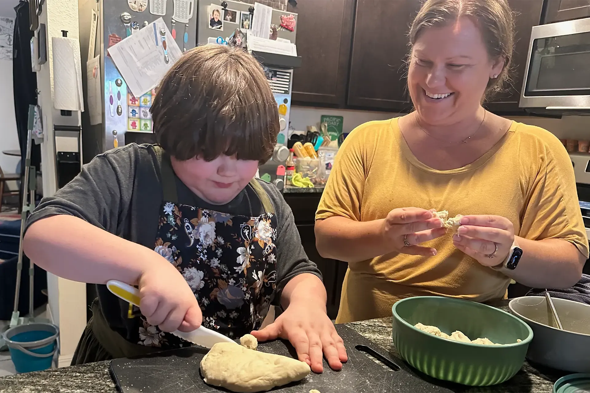 autistic child working with occupational therapist on food exercises