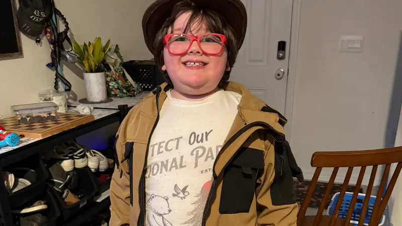a little boy with autism dressed up as Indiana Jones
